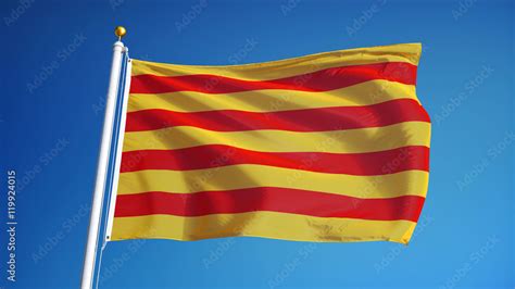 Catalunya flag waving against clean blue sky, close up, isolated with ...