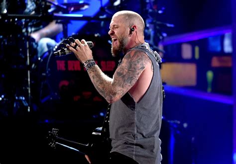 Brantley Gilbert’s Tattoos Reflect His Faith, Patriotism