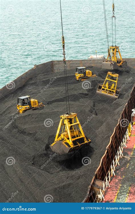 Loading Coal from Cargo Barges Onto a Bulk Vessel Using Ship Cranes ...