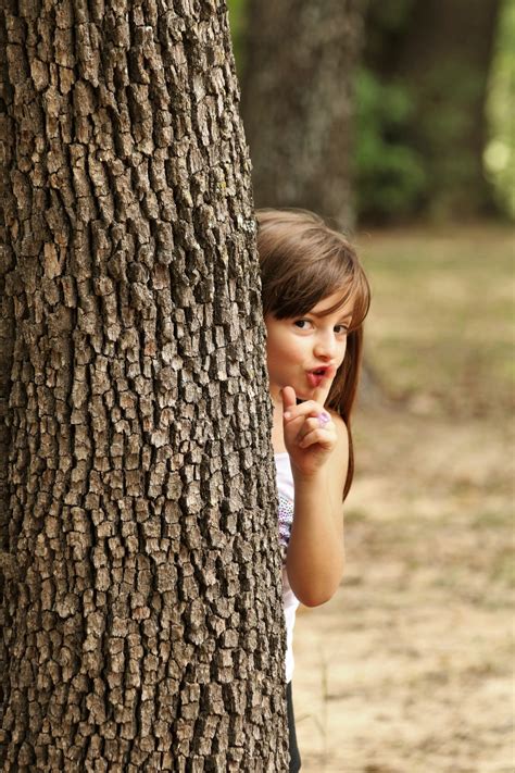 Little Girl Hiding Behind Tree Free Stock Photo - Public Domain Pictures