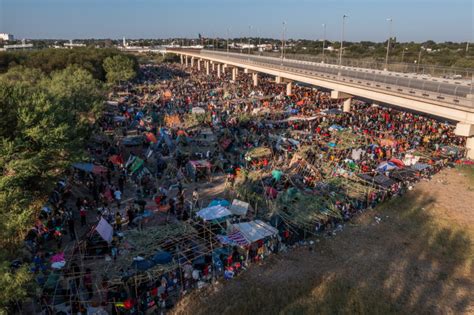 Migrant camp along Texas border shrinks as removals ramp up | PBS News