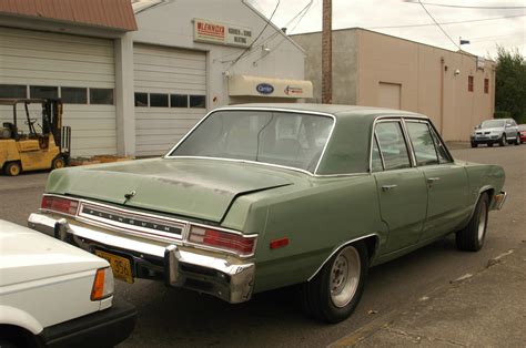 OLD PARKED CARS.: 1975 Plymouth Valiant Custom.