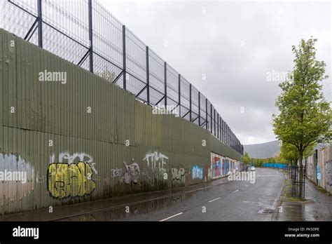 The Peace wall in West Belfast, Northern Ireland Stock Photo - Alamy