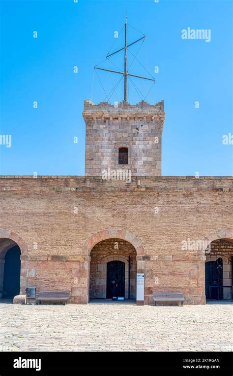 Montjuic Castle. Tower and arched doors. Medieval stone wall ...