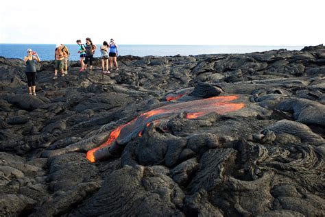 Lava from Hawaii volcano cascades into sea in vivid display