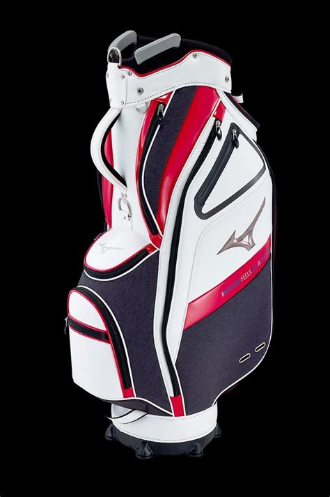 a white and red golf bag sitting on top of a black background