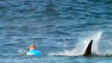 3-time world champ Fanning escapes shark attack during surfing ...