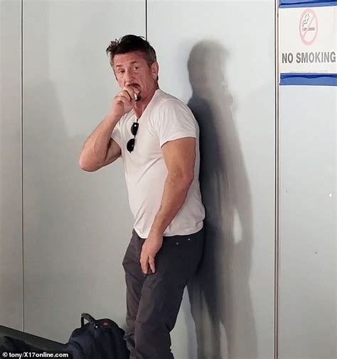 Sean Penn enjoys a cigarette next to a 'no smoking' sign at LAX - Hot ...