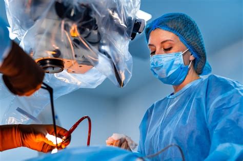 Premium Photo | Doctor in uniform operating patient Group of medical ...