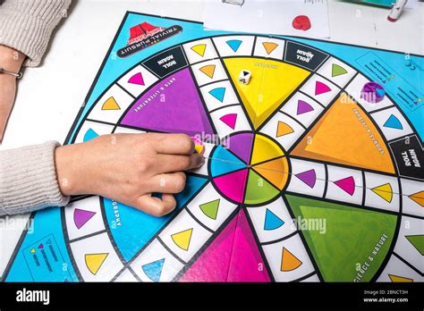 Playing Trivial Pursuit board game Stock Photo - Alamy