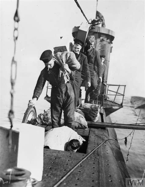 HMS Ursula crew taking on board stores and provisions at HMS Dolphin ...