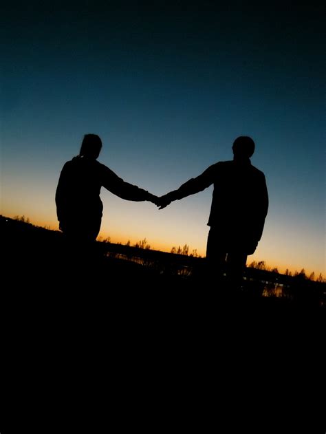 Two People Holding Hands Silhouette