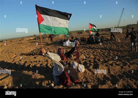 Palestinian demonstrators during a protest at the Israel-Gaza border ...