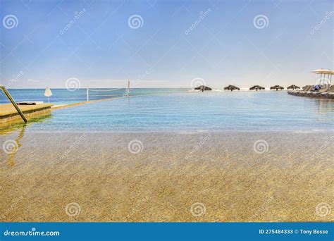 Infinity Pool on the Beach stock image. Image of vacation - 275484333