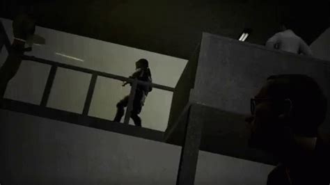 two people walking up stairs in the dark, one is talking on a cell phone