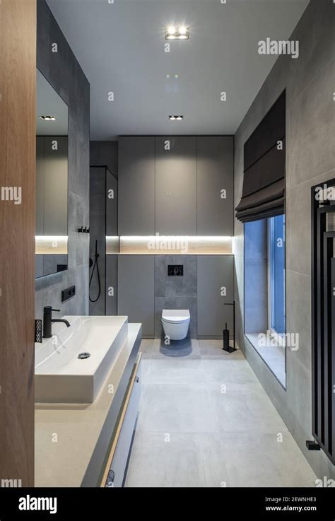 Modern interior of bathroom in luxury contemporary apartment. Grey ...