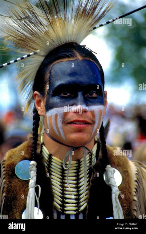 mohican with typical headdress of feathers and face painting at the pow ...