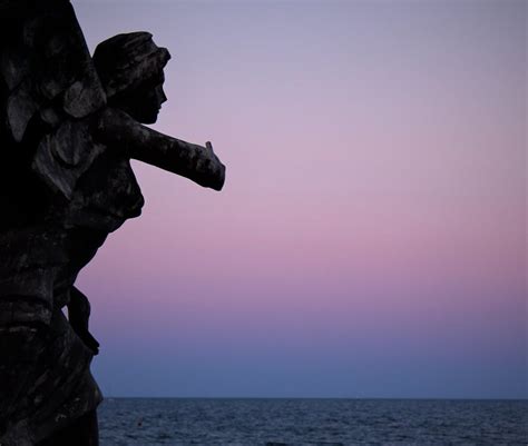 Sculpture Against Sky and Sea · Free Stock Photo