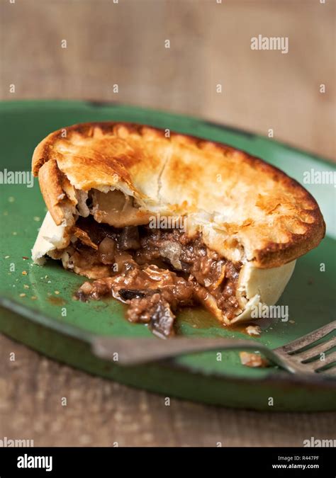 rustic meat and mushroom pie Stock Photo - Alamy