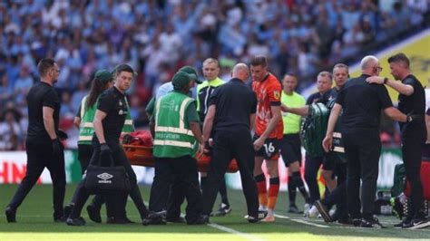 Luton Town captain Tom Lockyer in hospital after collapsing during ...