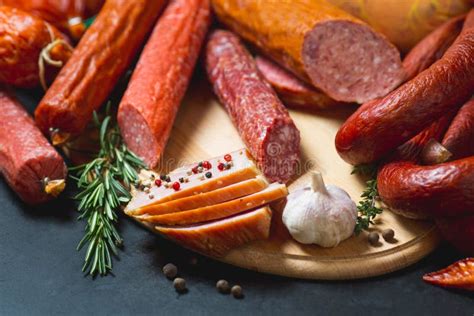 Different Types of Sausages and Meat Products on a Black Background ...