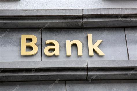 Premium Photo | Bank Sign on Building Facade