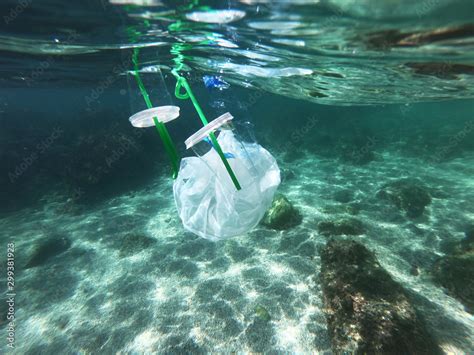 Plastic bags and bottles pollution in ocean Stock Photo | Adobe Stock