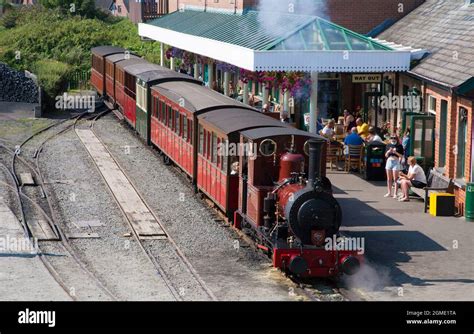 A train waits at Tywyn Wharf Station at the The Talyllyn Railway ...