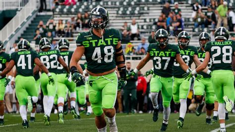 Michigan State football's neon uniforms booed on social media