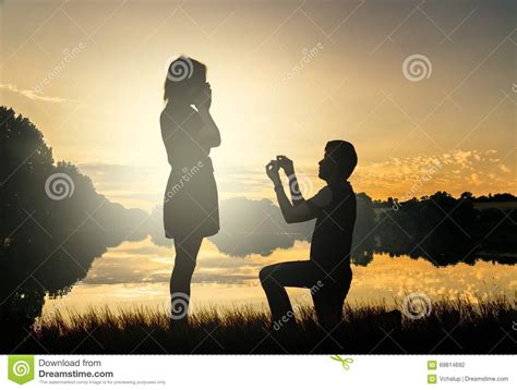 Wedding Proposal Concept. Young Couple Have Dating at Sun Set Stock ...