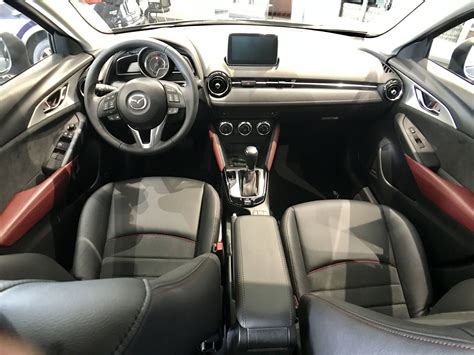 Mazda CX-3 interior front seat, black leather and suede with red ...