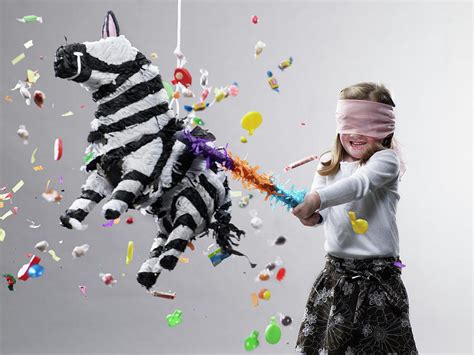 Young Girl Hitting Pinata, Candy Flying Photograph by Ryan Mcvay - Fine ...