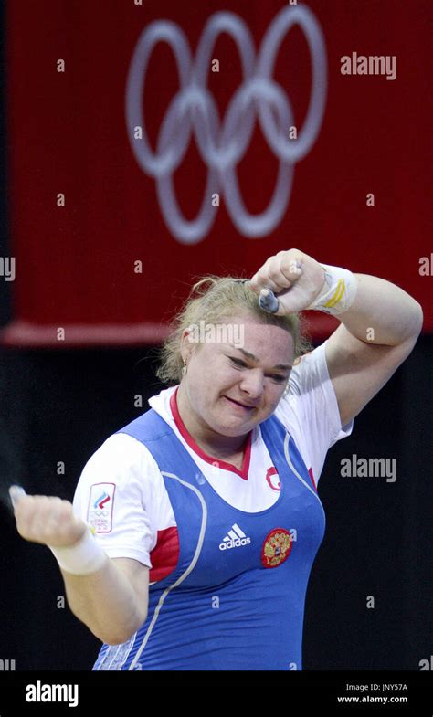 London, Britain - Russia's Tatiana Kashirina celebrates after lifting ...