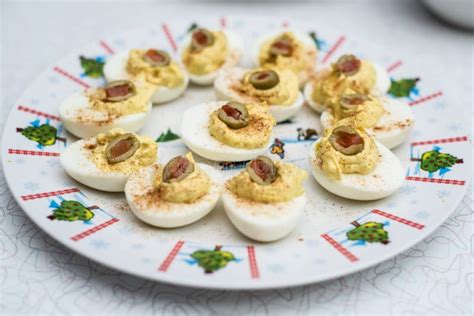 Deviled Eggs with Olives on Christmas Platter Stock Image - Image of ...