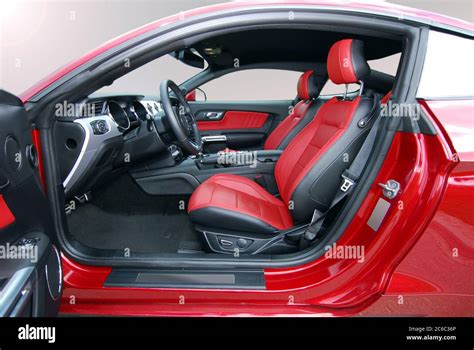 Interior of a sports car. Red leather interior of luxury red sport car ...