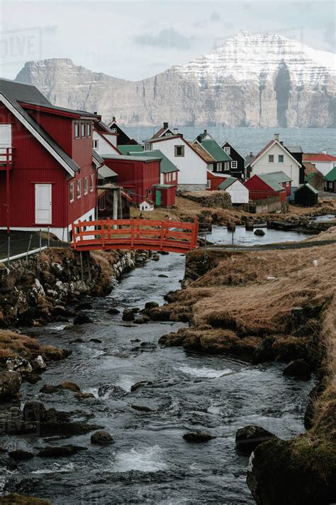 Amazing view of settlement with cottages located near fast river in ...