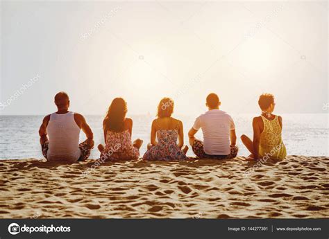 Group of five friends on beach Stock Photo by ©cppzone.mail.ru 144277391