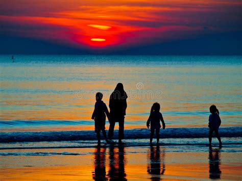 Silhouette of a Family in the Sunset Stock Photo - Image of happiness ...