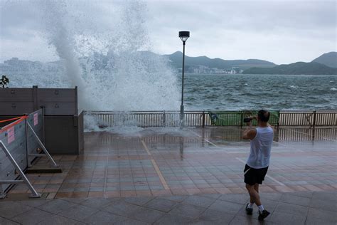 Typhoon Talim hammers China leaving flooded streets and uprooted trees ...