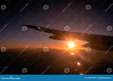 Beautiful Sunrise Or Sunset Over The Clouds Through Airplane Window ...