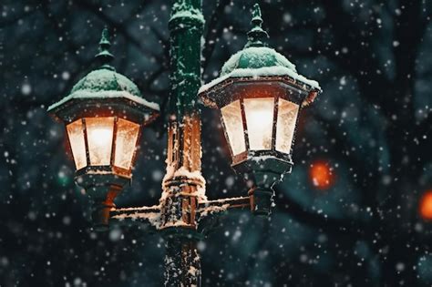 Premium Photo | Snowfall in the city Street lamp on a snowy winter night