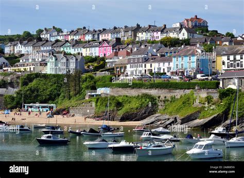 a view of the picturesque seaside town of New Quay Wales looking up to ...