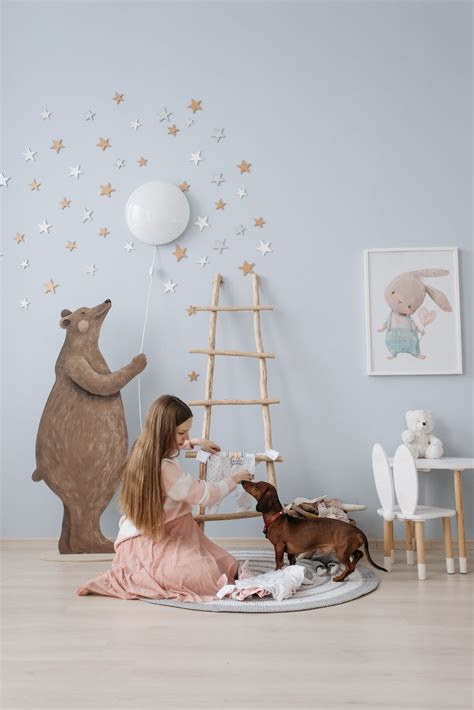 An Expectant Mother Decorating the Baby's Room · Free Stock Photo