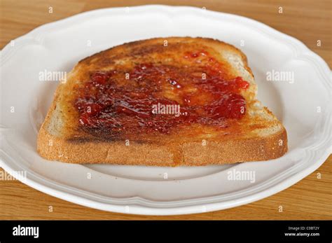 Strawberry jam on toast Stock Photo - Alamy