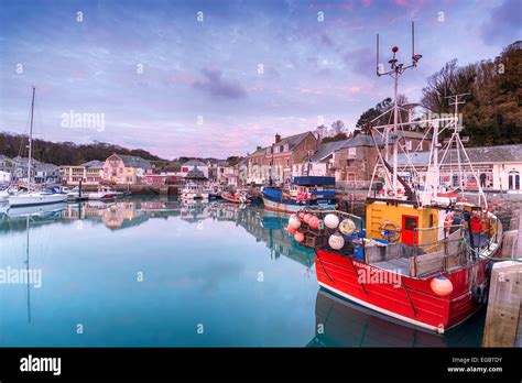 Fishing boats in Padstow harbour at sunrise Stock Photo - Alamy