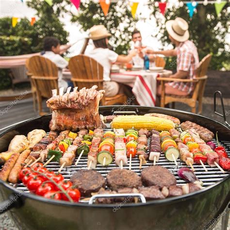 Family having a barbecue party in their garden Stock Photo by ©FreeProd ...