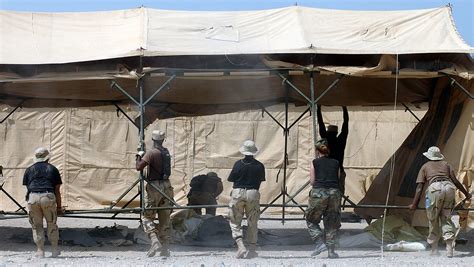 Several deployed Air Force members join to set up TEMPER (Tent ...