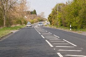 What does it mean when an area of road is painted with white diagonal ...