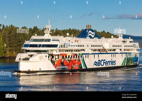 Ferry in front of Coast Mountains. BC Ferry crossing the strait in gulf ...