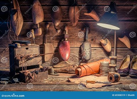 Vintage Cobbler Workshop with Tools, Shoes and Laces Stock Image ...